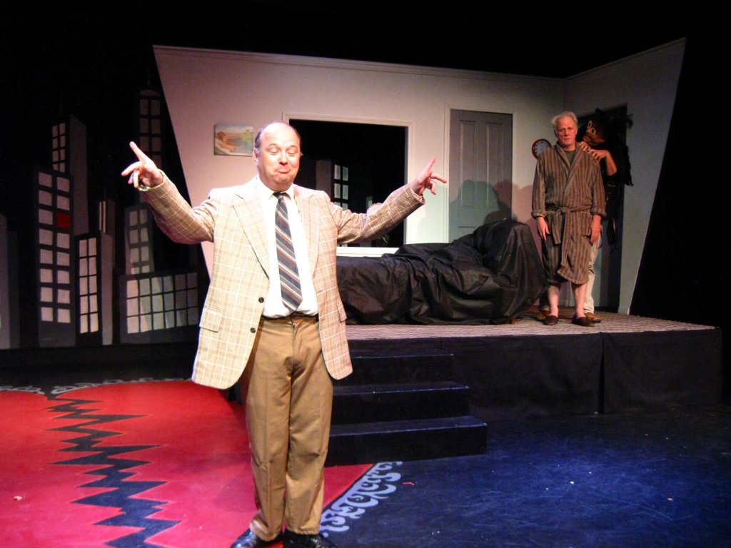 Host Padraic Duffy (Joseph Beck) tallies the audience applause to determine this week's winners.